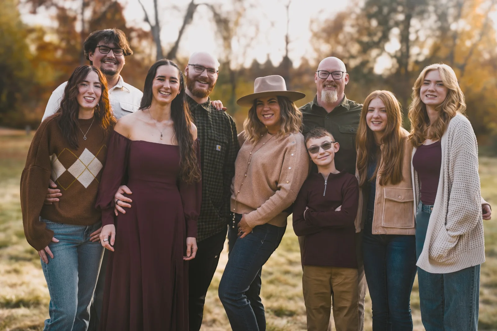 Dr. Nuzum with his family outdoors on an autumn afternoon
